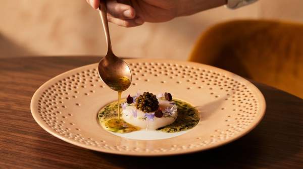 Editorial illustration for Michelin Stars, Bib Gourmand, and the Green Star: What Each Award Actually Tells a Diner